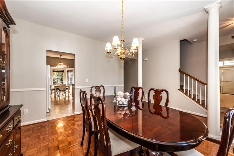 Dining room has room for a larger table and a china cabinet or sideboard. Freshly painted.