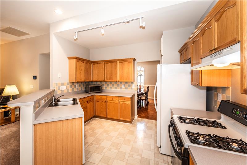 Kitchen features gas range, nice counter and storagespace, plus a pantry.