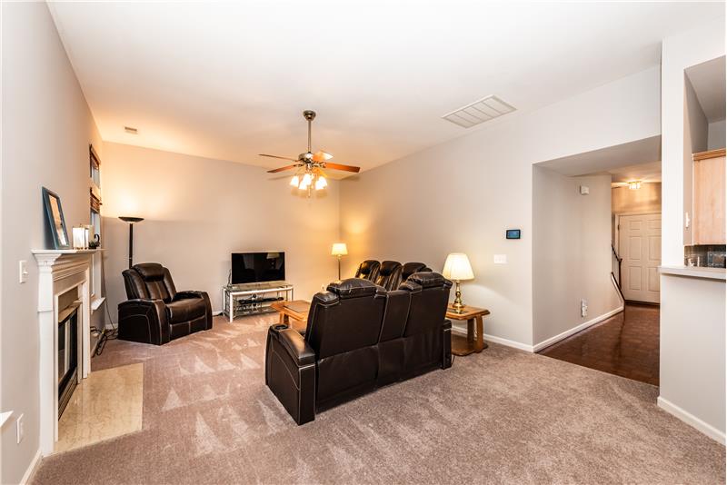 Spacious great room with room for generous seating and wall space for large screen TV.