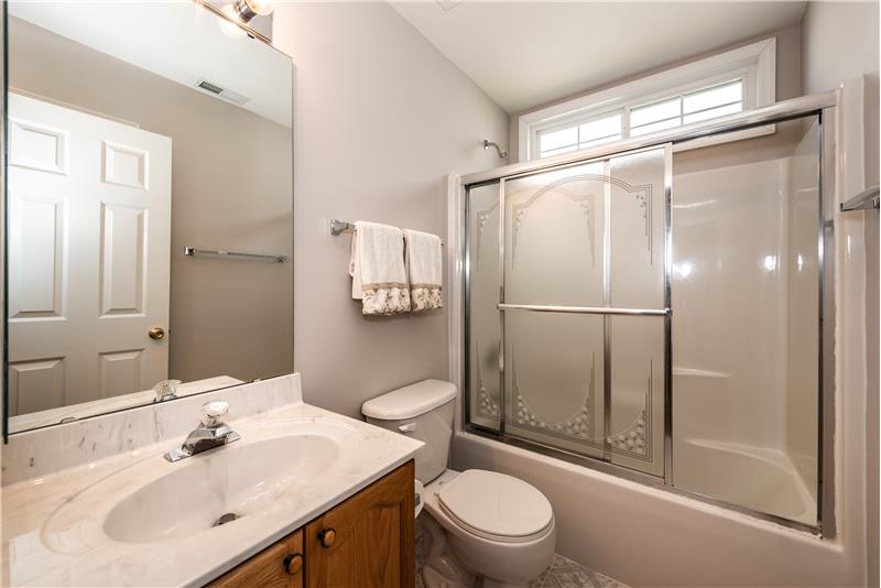 Full bathroom on the home's main floor. Freshly painted. Window above tub/shower provides nice natural light.