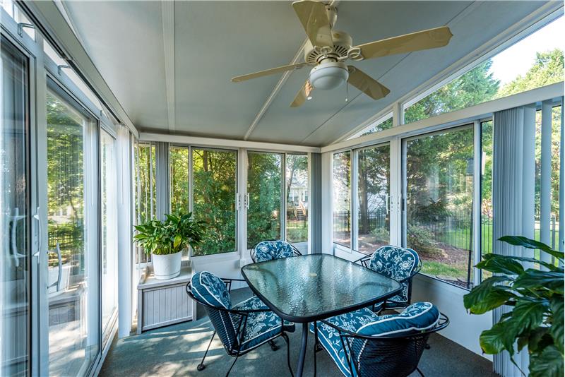 Custom built sunroom is a natural extension of the home's living and entertaining space. Open the windows, it's a screened porch