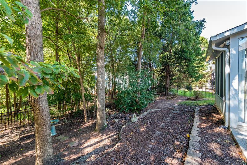 Low-maintenance back yard; lots of mature trees provide shade and privacy.