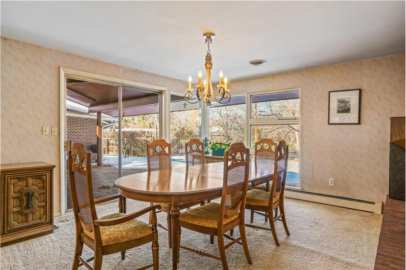 Dining room has sliding glass door to covered patio
