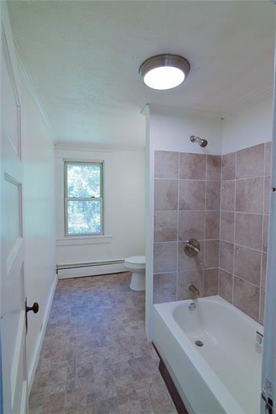 Renovated bathroom - new tub and tile on wall