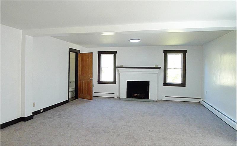 Door near fireplace is access to newly added bathroom