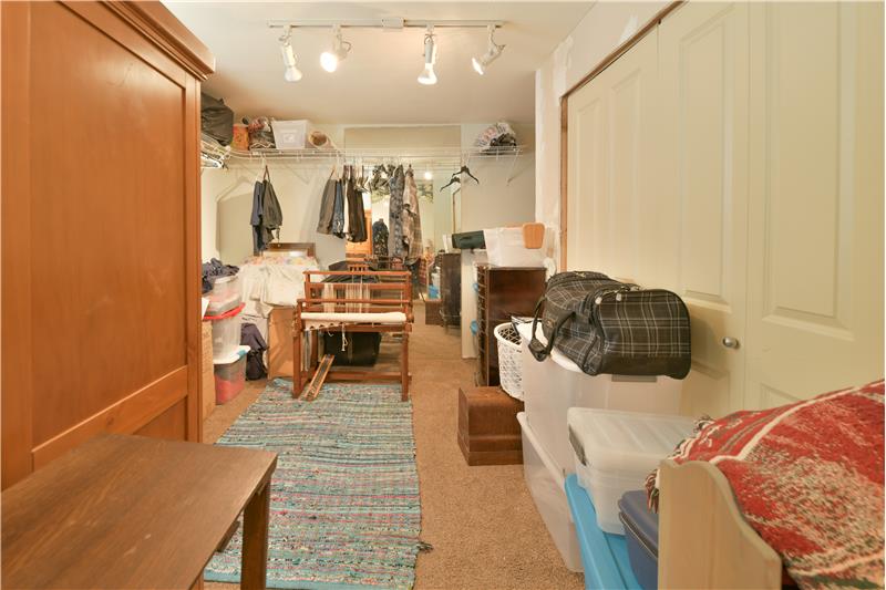 Conjoined bedroom to first, acting as a closet