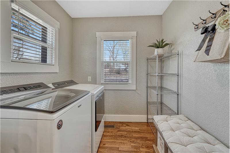 Laundry room with windows and washer/dryer included