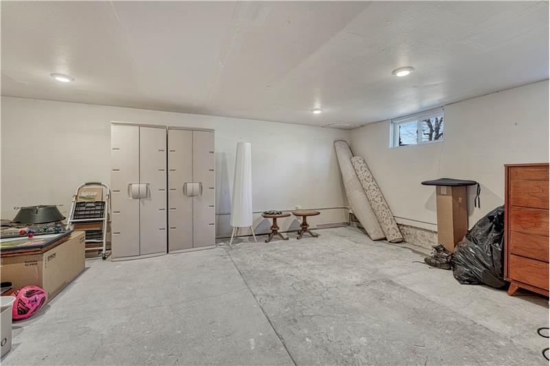Unfinished Basement with recessed lighting