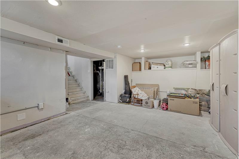 Unfinished Basement with recessed lighting