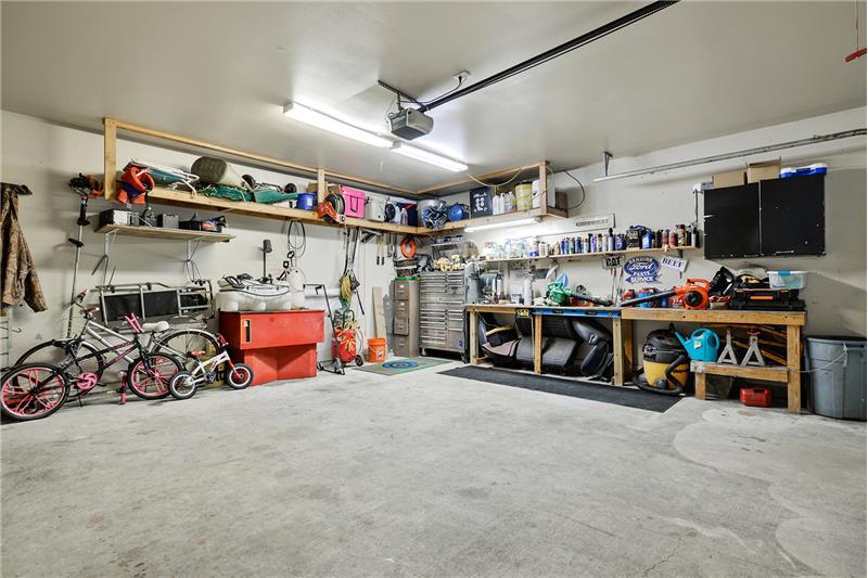 Garage has a 10.5 x 4.5 storage room and ample parking space