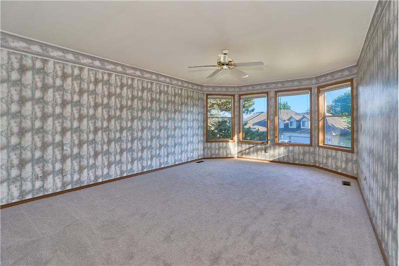 Very Large Primary Bedroom, with Ceiling Fan and a View of Mount Rainier.