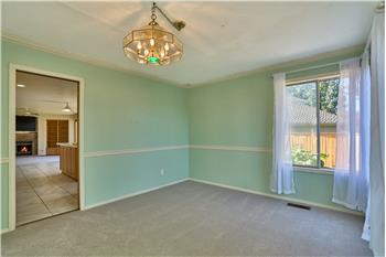Big Formal Dining Room with a View into the Kitchen and Family Room.