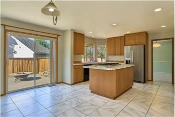 View of the Kitchen, Large Breakfast Nook and Slider that leads to the Patio.