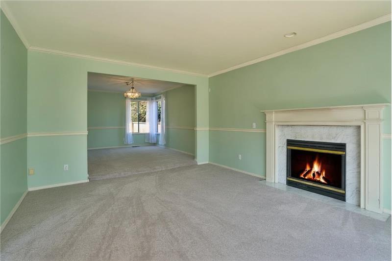 View of the Formal Living and Dining Room. New Carpets Throughout this Lovely Home.