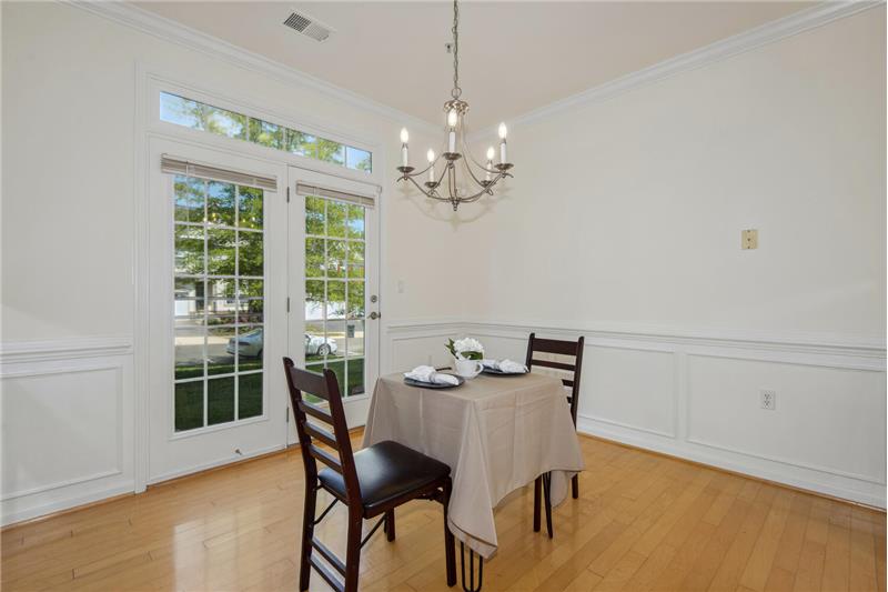 Dining Room has Patio Door that Walks Out to Grassy Common Area