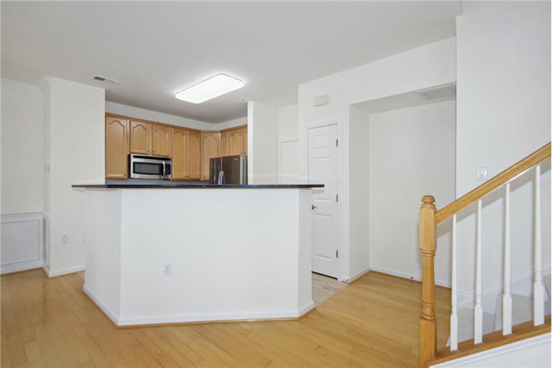 Kitchen Overlooks Living & Dining Rooms