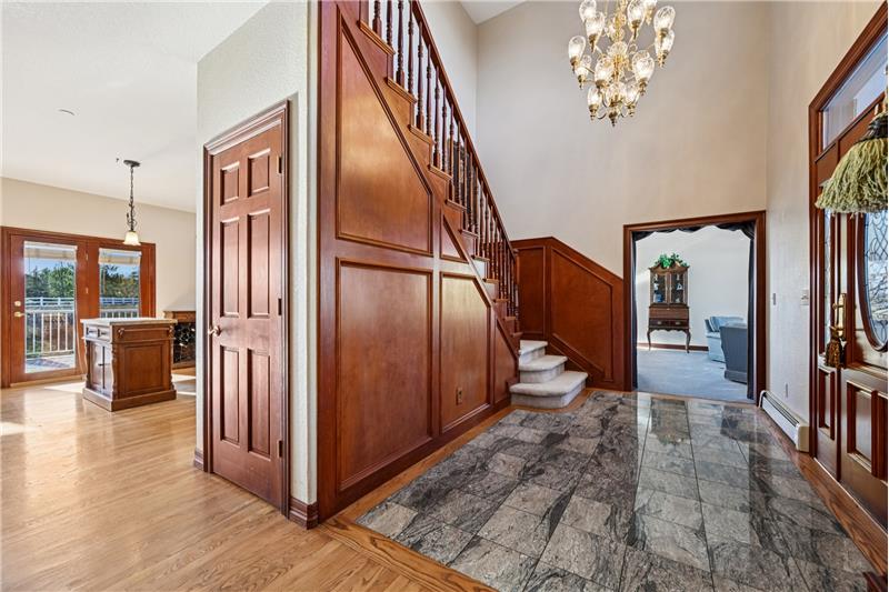 Foyer, with kitchen at left and living room to the right