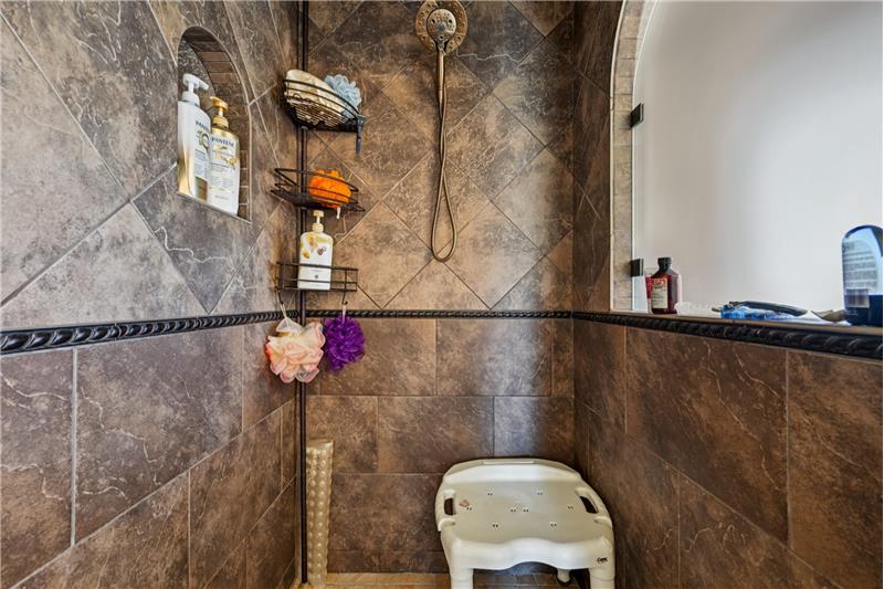 Spacious shower in primary suite bathroom