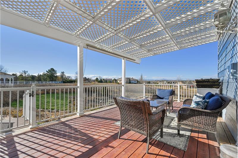 Deck with pergola outside kitchen 