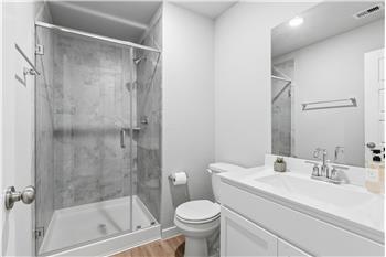 One of 3 full bathrooms.  Walk-in shower.
