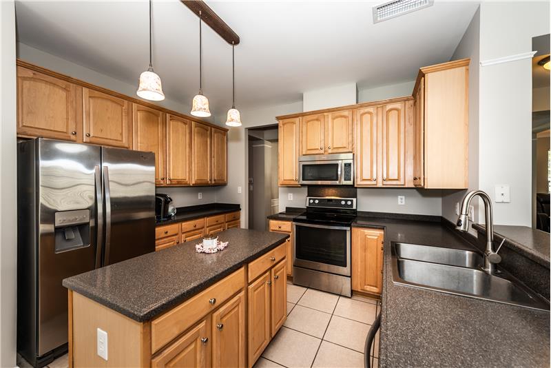 Kitchen: stainless steel appliances; lots of cabinet storage and counter space plus a double-size pantry.