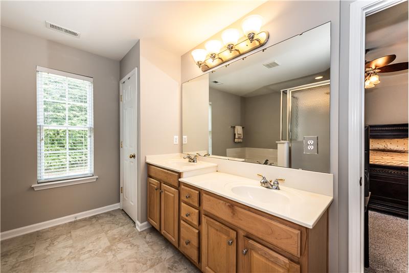 Owner's en-suite bathroom: huge walk-in closet and a linen closet. Window adds great natural light.