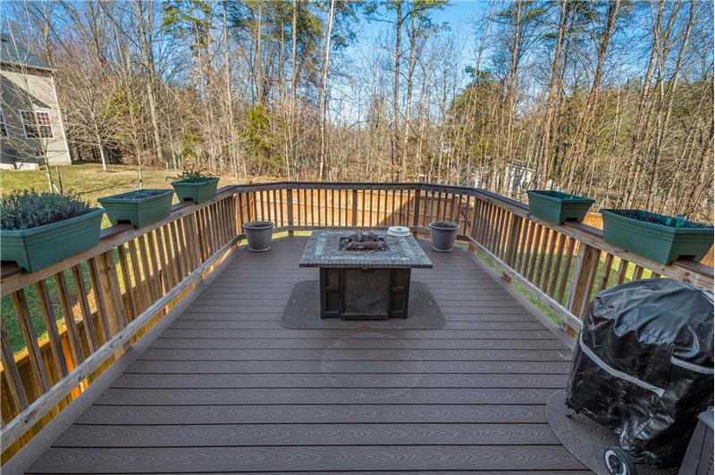 Composite Deck overlooks Treed View and Fenced Yard