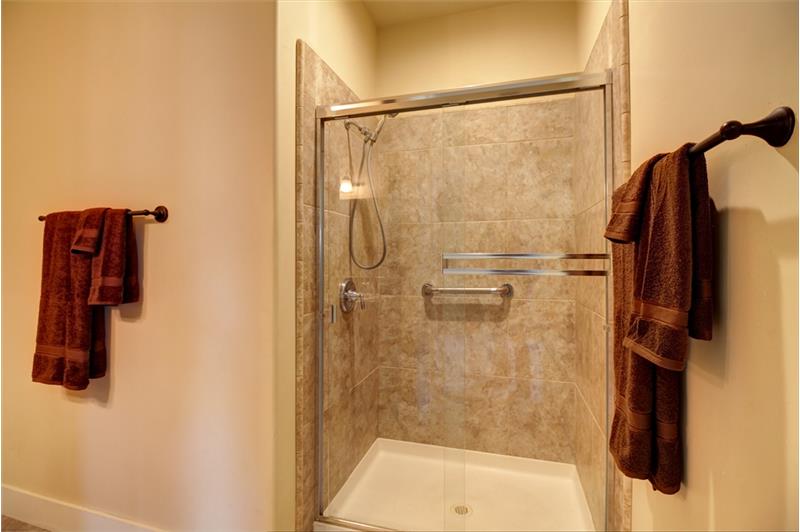 Grab bars installed in both private water closet as well as oversized step-in shower provides form & function!