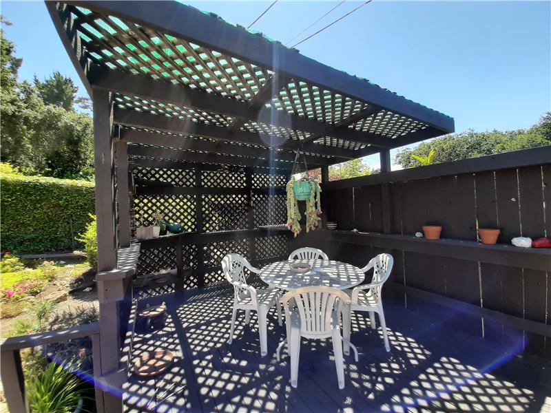 The Deck Extends all the way back to the Covered Patio, perfect for Mid-Day Muted Sunshine and Evening Dinners Outside!