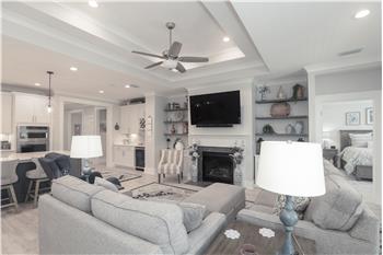 Gathering Room has gas fireplace & built-in shelves with cabinet storage