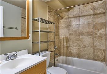 Downstairs Full Bathroom with Tile Surround Shower.