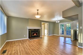 Freshly Painted inside and outside. Living Room and Dining Room with Tile Surround Gas Fireplace with Laminate Hardwood Floors.