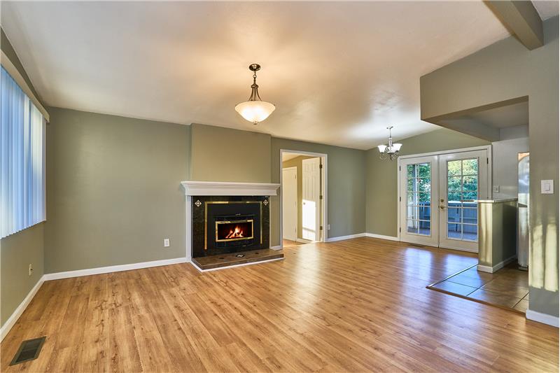Freshly Painted inside and outside. Living Room and Dining Room with Tile Surround Gas Fireplace with Laminate Hardwood Floors.