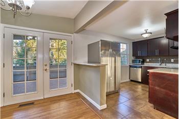 View from the Dining Room looking into the Kitchen and Covered Deck.