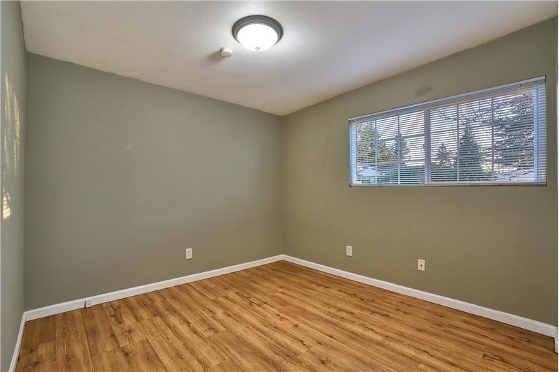 Main Floor Primary Bedroom with Laminate Floors.