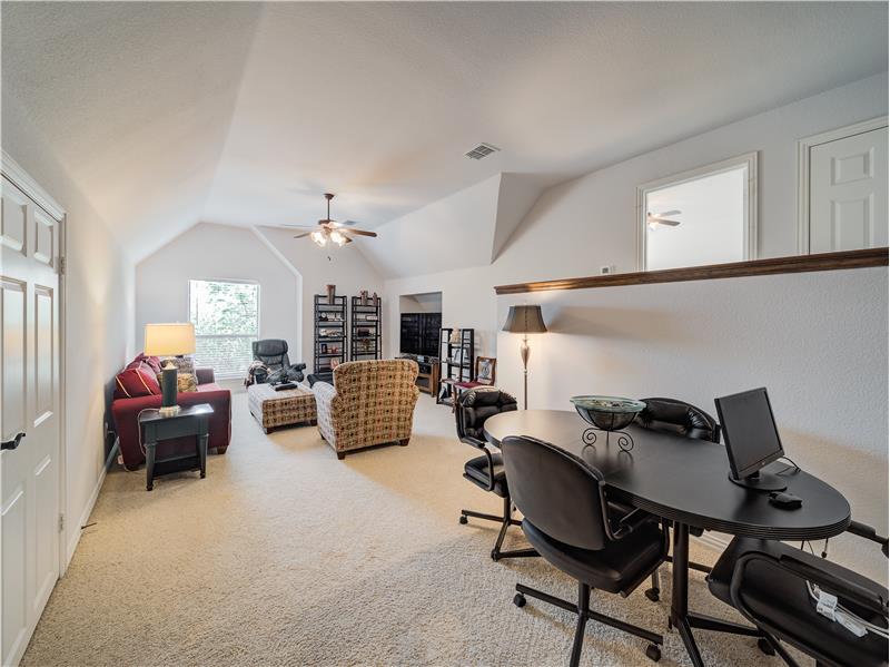 Upstairs you will find a versatile space to accommodate play/media room and desk