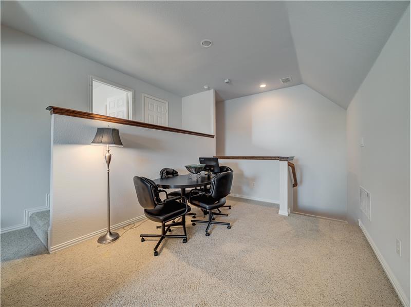 Upstairs you will find a versatile space to accommodate play/media room and desk