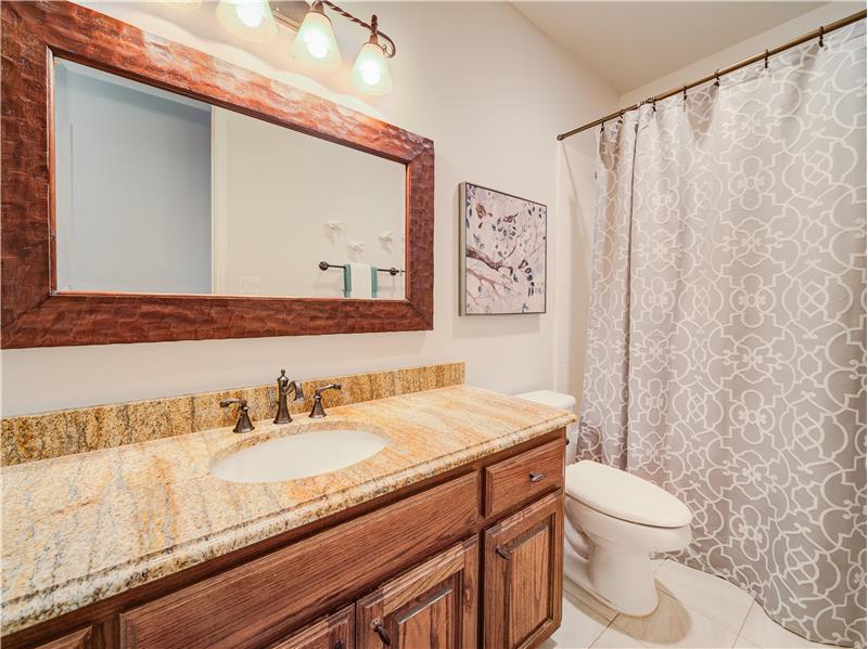 Downstairs full bath with granite vanity