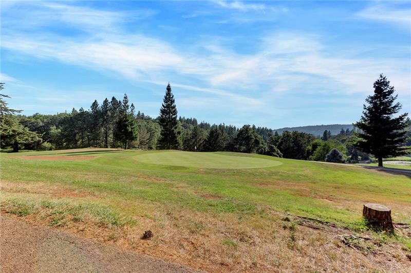 Backs to Golf Cart Path and 14th Hole