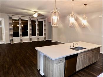 Open floor plan with bonus pendant lighting