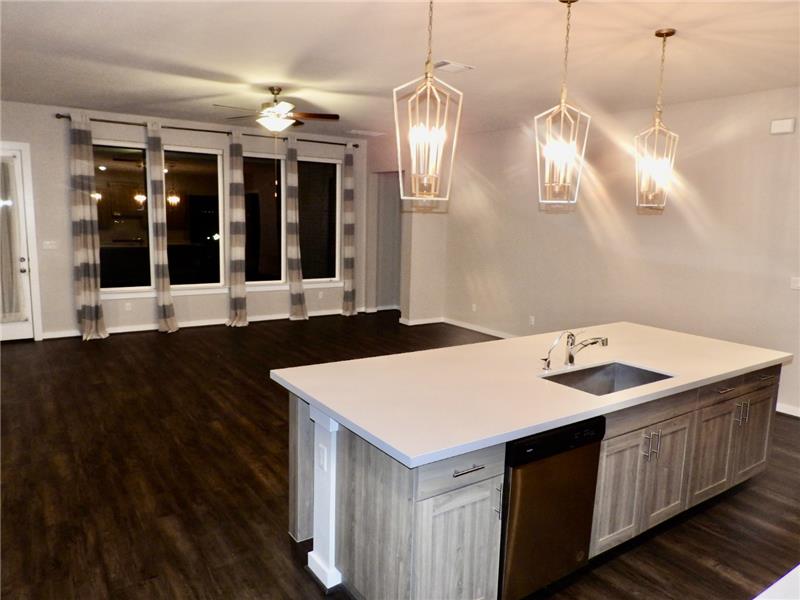 Open floor plan with bonus pendant lighting
