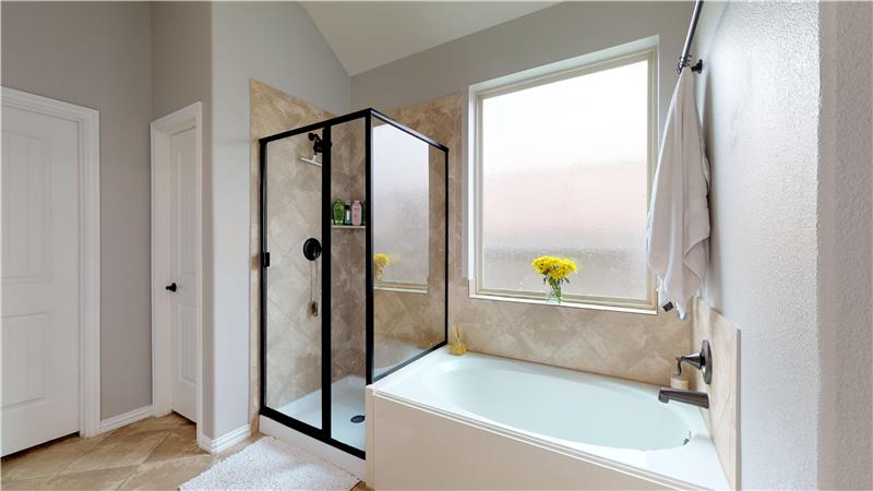 Master bathroom also features a large soaking tub and standup shower.