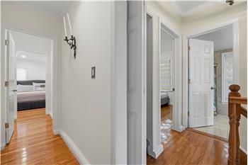 Finished lower level with neutral wall-to-wall carpeting, tile flooring, recessed lighting, and vertical blinds