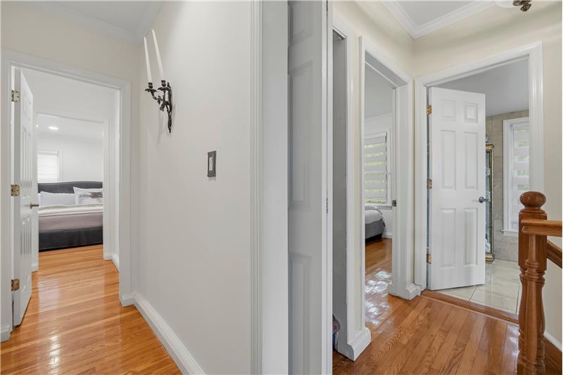 Finished lower level with neutral wall-to-wall carpeting, tile flooring, recessed lighting, and vertical blinds