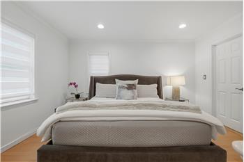 The oversized primary suite, with its cathedral ceiling-its own full bath, offers a private retreat  a quiet haven
