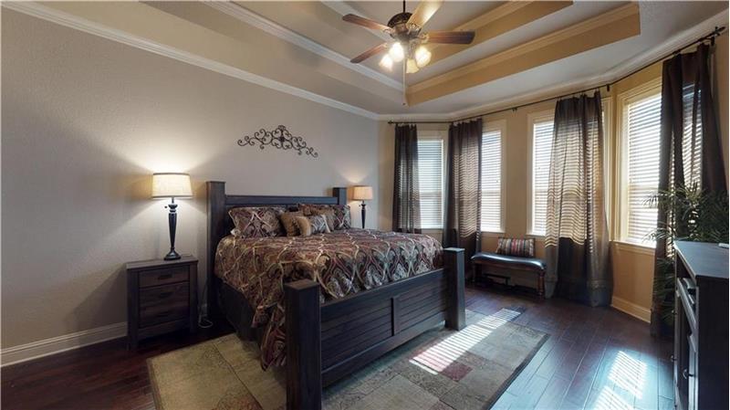 Nicely appointed master bedroom is split from second bedroom downstairs
