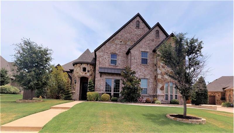 Stately exterior with beautiful stone and brick accents