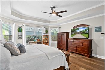 Owners Suite...Spacious with engineered hardwood flooring, step ceiling