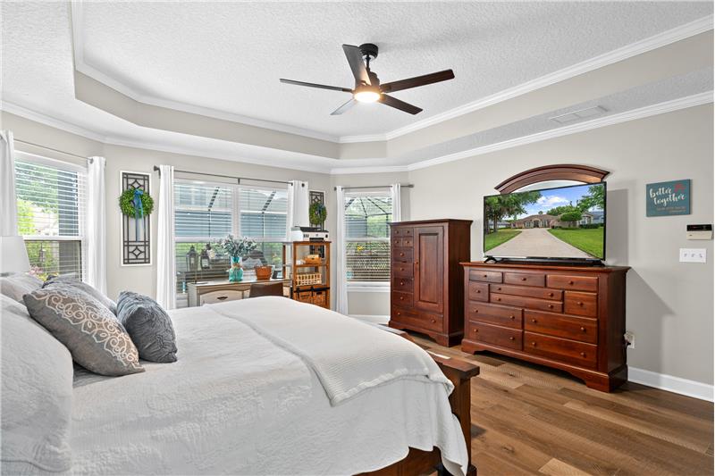 Owners Suite...Spacious with engineered hardwood flooring, step ceiling