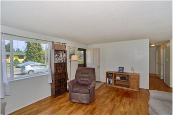 Front Entrance and View of the Living Room with Hardwood Floors.
